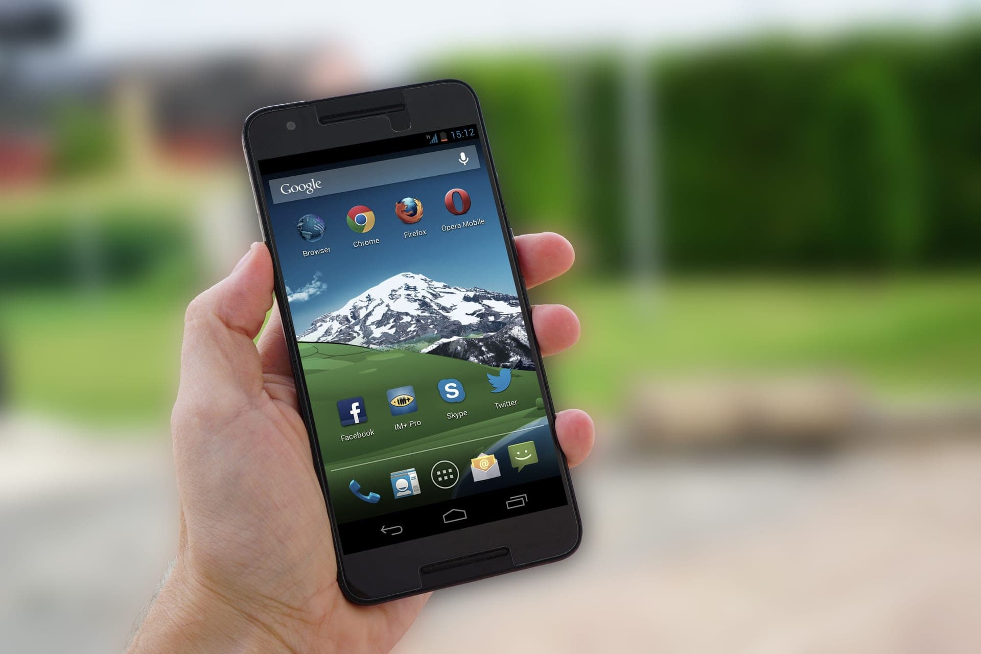 A smartphone held up outdoors